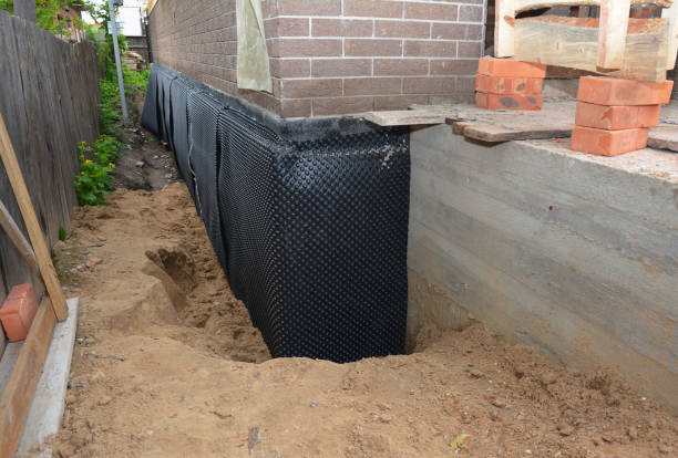 Happy homeowners after waterproofing job in Osgood
